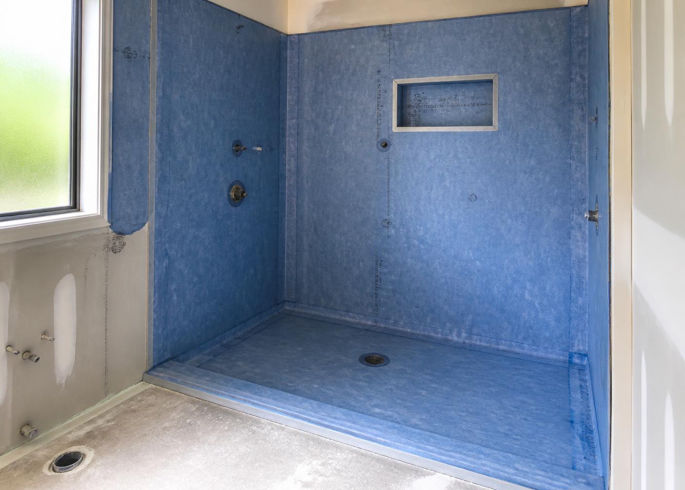 Bathroom shower recess with waterproofing membrane applied before tiling
